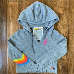 AVIATOR NATION CLASSIC BOLT STITCH CROPPED V-NECK HOODIE WITH NEON STRIPES